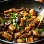 Stir-fried chicken with mushrooms in a colorful vegetable mix
